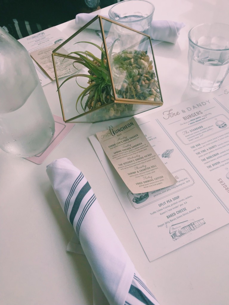 Water in glass milk jug, Fine&Dandy menu, and terrarium 